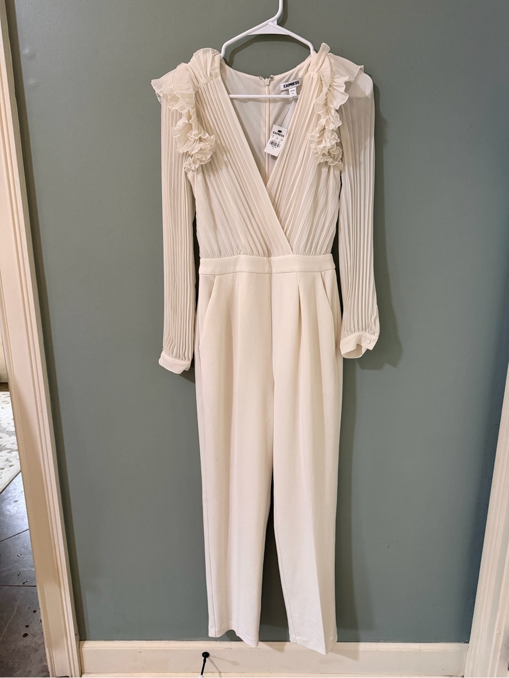 Express pleated ruffle shoulder jumpsuit in bone white. New with tags size 0
